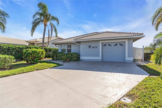 single story home featuring a garage