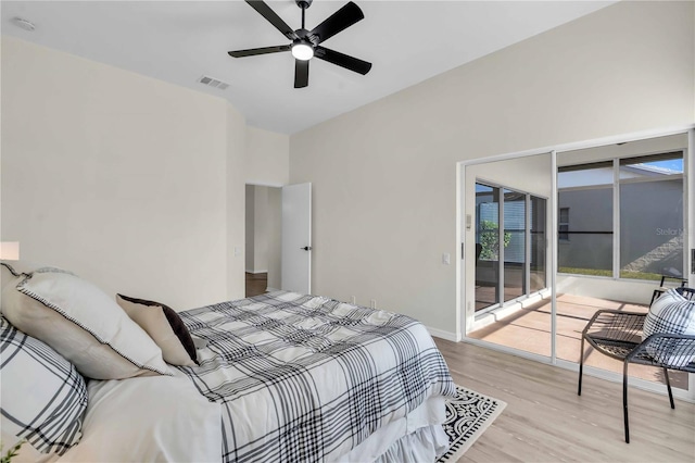 bedroom featuring access to outside, ceiling fan, and light hardwood / wood-style flooring