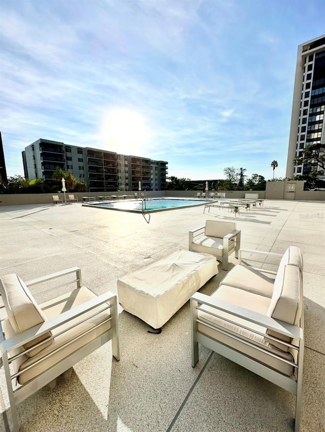 view of pool featuring a patio area