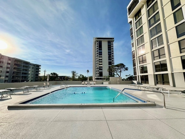 view of swimming pool with a patio