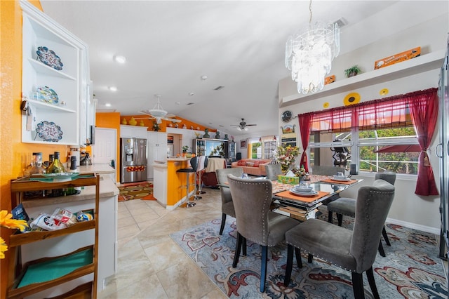 dining room featuring light tile patterned floors, ceiling fan with notable chandelier, and lofted ceiling