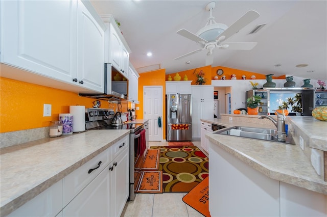 kitchen featuring sink, vaulted ceiling, ceiling fan, white cabinetry, and stainless steel appliances