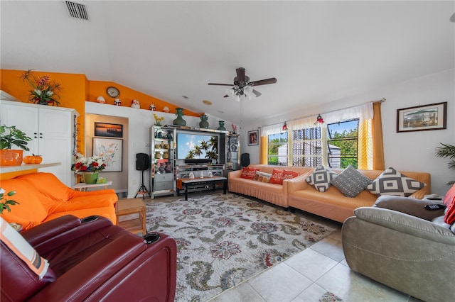 tiled living room with ceiling fan and vaulted ceiling