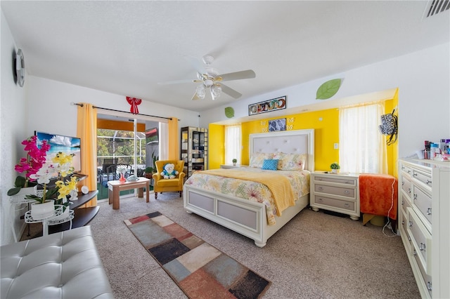 bedroom featuring carpet flooring, ceiling fan, and access to exterior