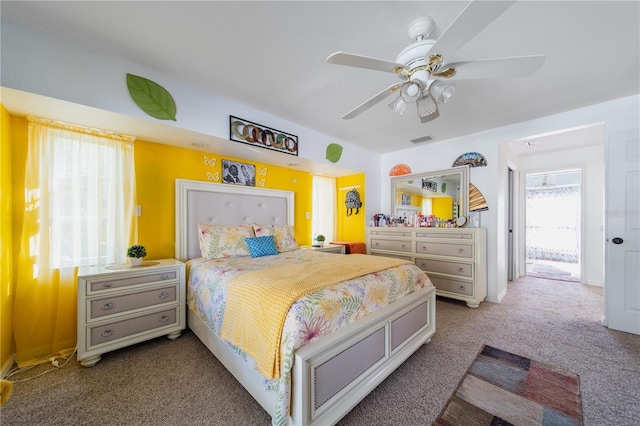 bedroom with ceiling fan and carpet floors