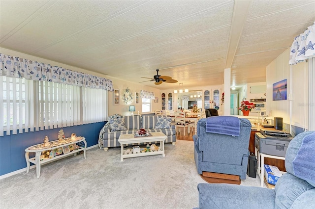 carpeted living room featuring beam ceiling, a textured ceiling, and ceiling fan