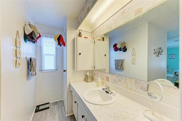 bathroom with vanity and hardwood / wood-style flooring