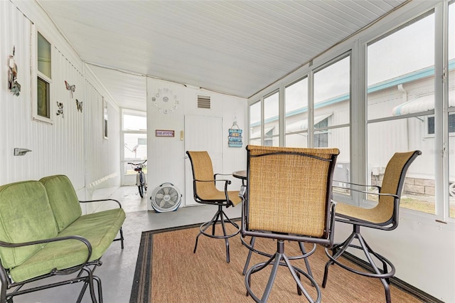 sunroom featuring lofted ceiling