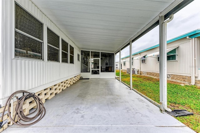 view of patio featuring a sunroom