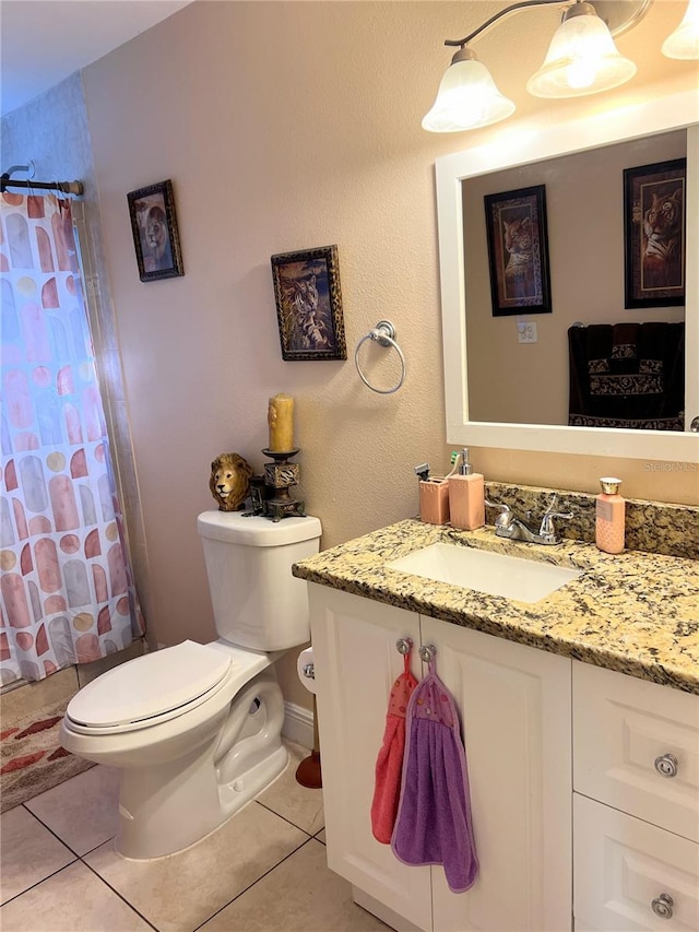 full bathroom with tile patterned floors, vanity, shower / tub combo, and toilet