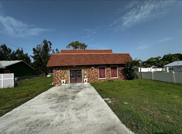 5630 3rd St W, Bradenton, FL 34207 - view of front facade featuring french doors and stone siding