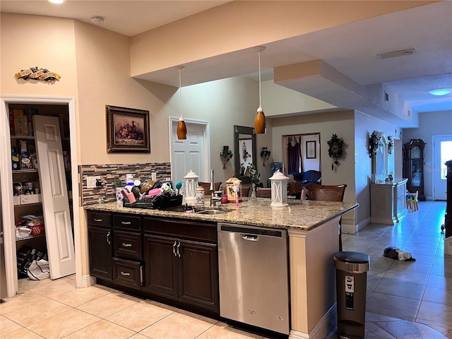 5630 3rd St W, Bradenton, FL 34207 - kitchen featuring stainless steel dishwasher, light tile patterned flooring, light stone countertops, tasteful backsplash, and pendant lighting