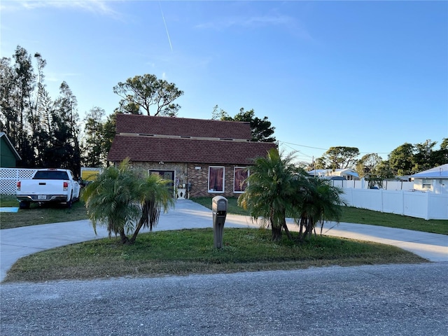 5630 3rd St W, Bradenton, FL 34207 - view of front of house with curved driveway and roof with shingles