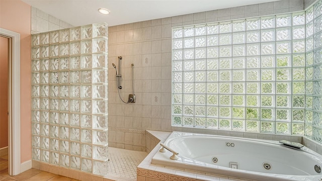 bathroom featuring tile patterned flooring and plus walk in shower