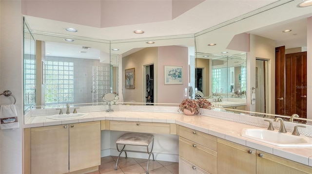 bathroom featuring tile patterned flooring and vanity