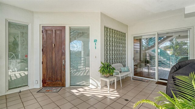 350 Gulf Of Mexico Dr Unit 211, Longboat Key, FL 34228 - property entrance with stucco siding
