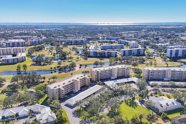 bird's eye view featuring view of golf course and a water view