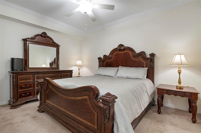 carpeted bedroom featuring ceiling fan and ornamental molding