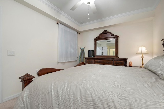 carpeted bedroom with ceiling fan and ornamental molding