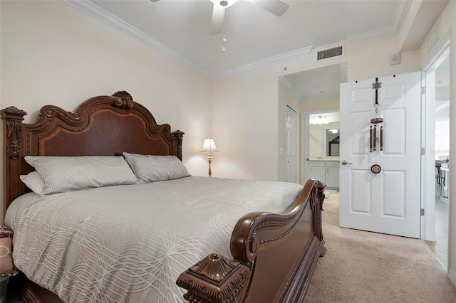 bedroom featuring ceiling fan, ornamental molding, light carpet, and ensuite bath