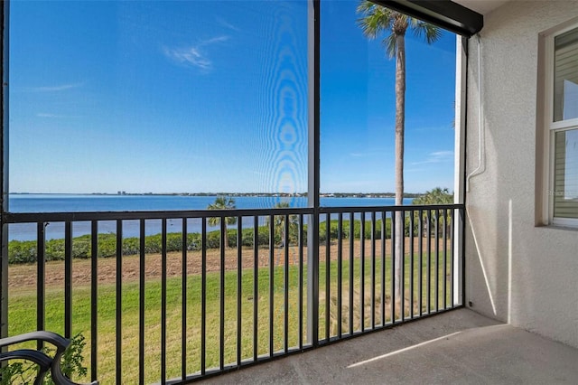 balcony featuring a water view