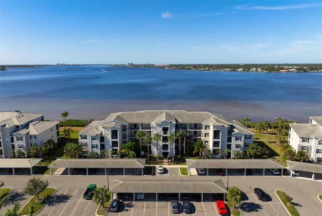 birds eye view of property with a water view