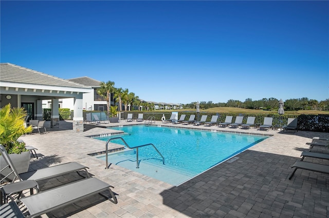 view of pool featuring a patio