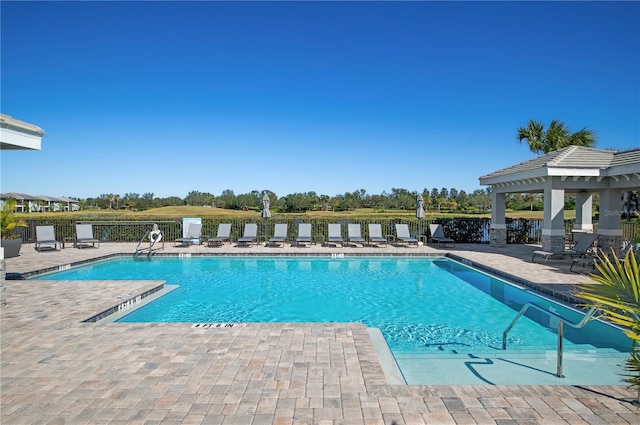 view of swimming pool with a patio