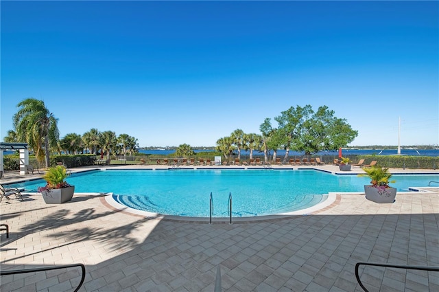 view of swimming pool with a patio area