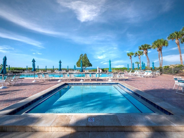 view of swimming pool featuring a patio