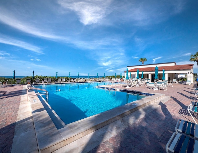 view of swimming pool featuring a patio