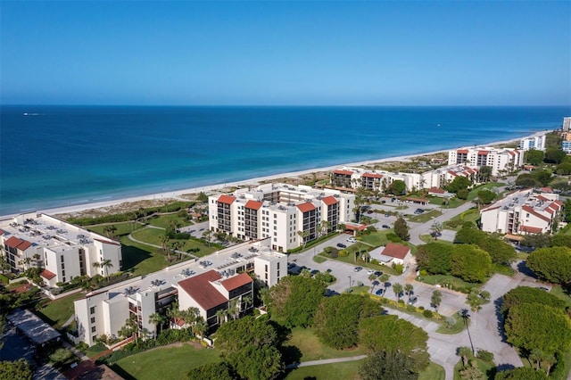 bird's eye view featuring a beach view and a water view