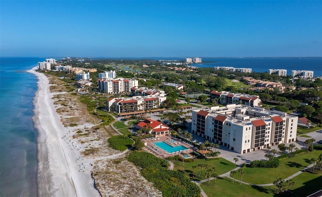 bird's eye view featuring a water view and a view of the beach