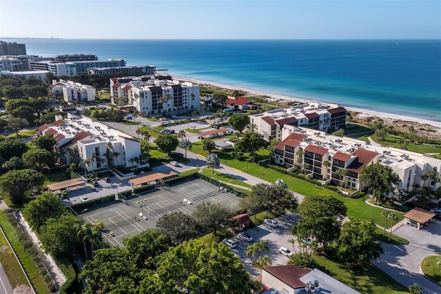 drone / aerial view with a water view and a view of the beach