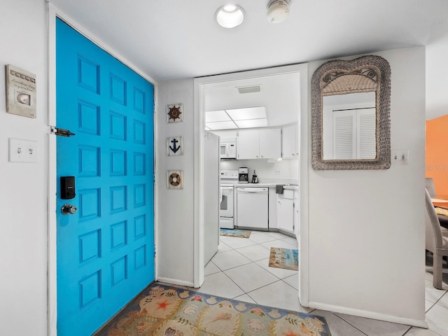 foyer with light tile patterned floors