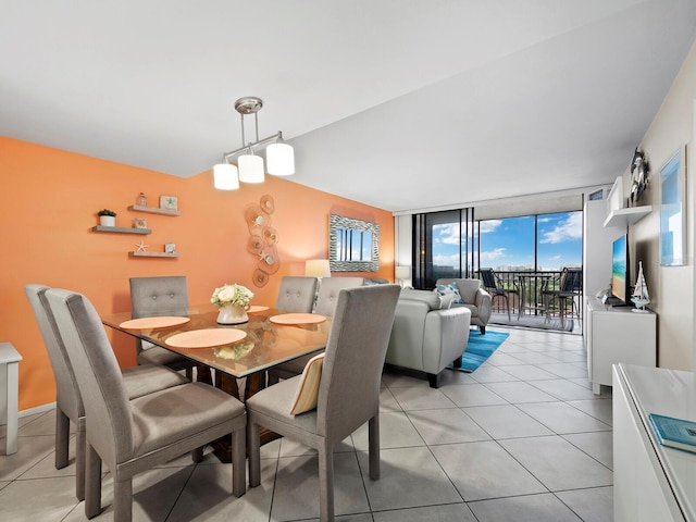 dining room featuring expansive windows and light tile patterned flooring