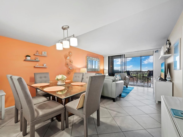 2045 Gulf Of Mexico Dr Unit M1-502, Longboat Key, FL 34228 - dining space featuring expansive windows and light tile patterned floors