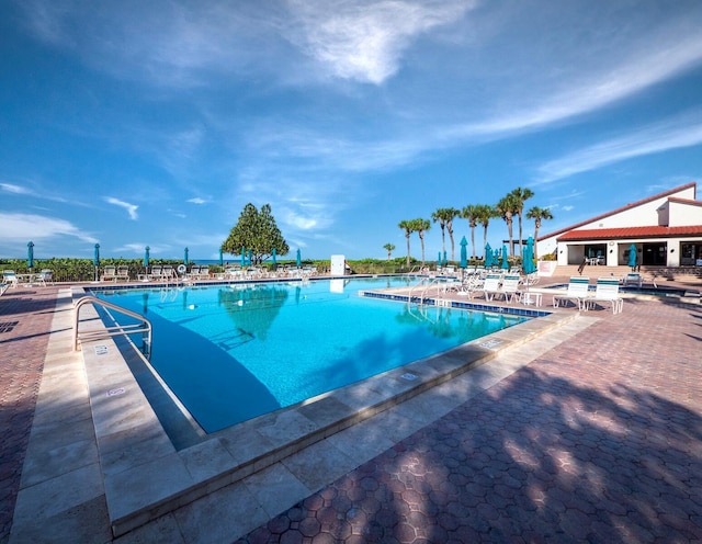 view of swimming pool with a patio area