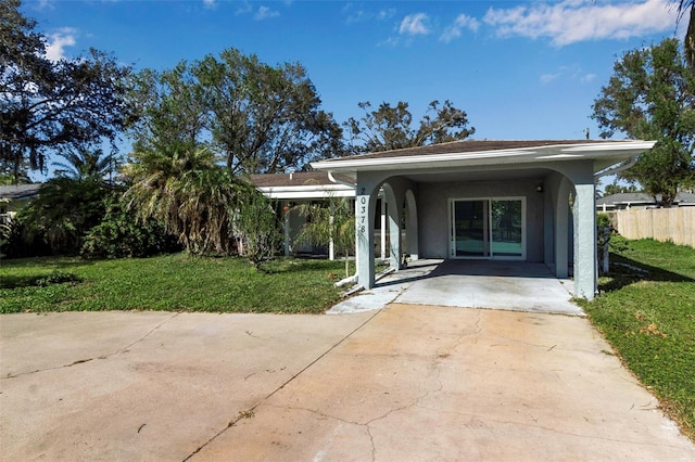 exterior space with a carport