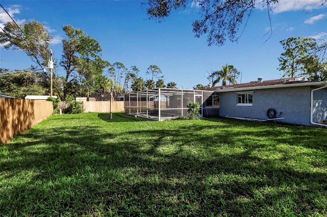 view of yard with a lanai