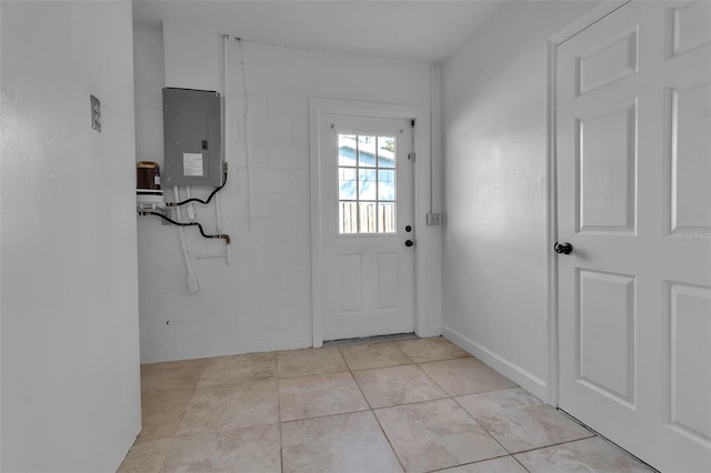 entryway with light tile patterned flooring and electric panel