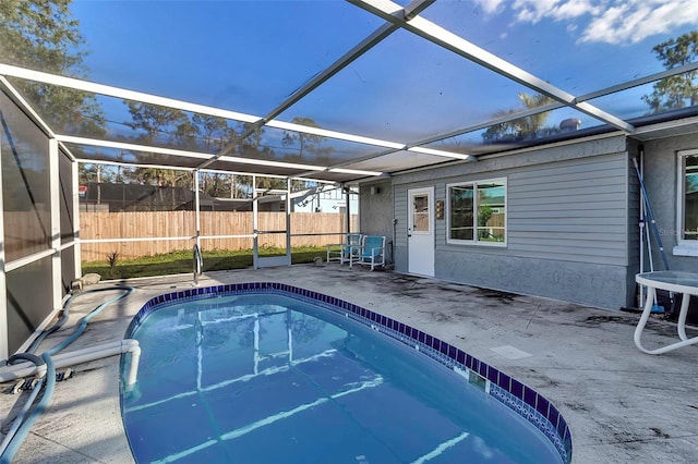 view of pool featuring a lanai and a patio