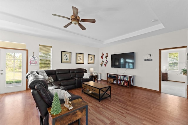 living room with hardwood / wood-style floors, plenty of natural light, and ceiling fan