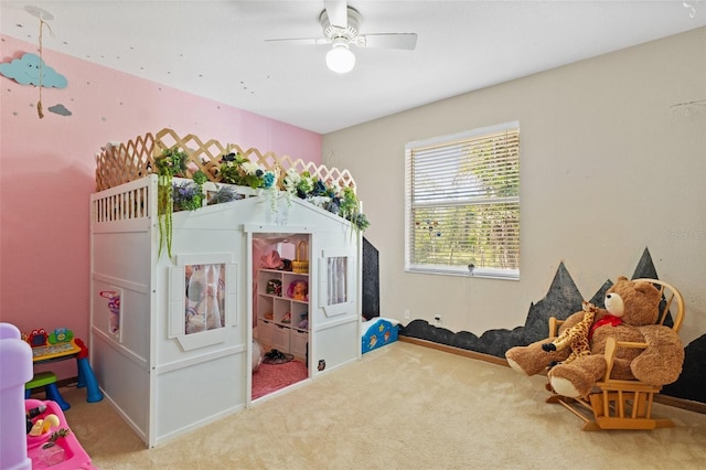 recreation room with carpet flooring and ceiling fan