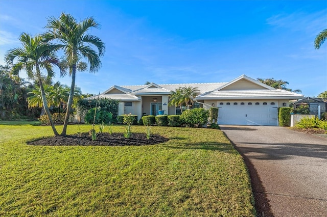 single story home featuring a front yard and a garage