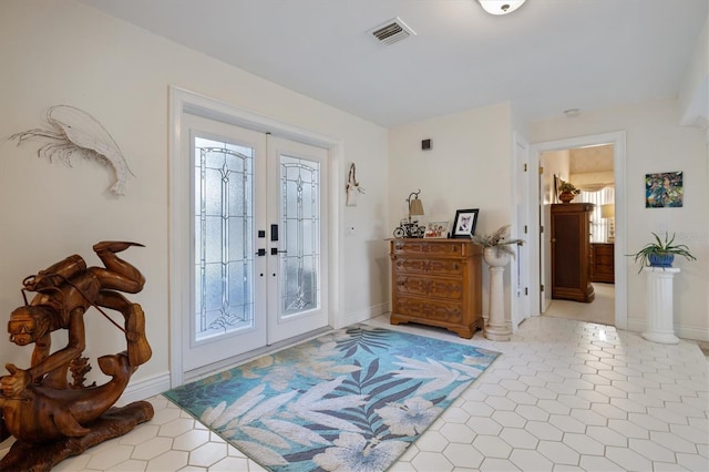 tiled entryway with french doors