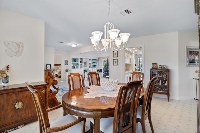 tiled dining room with a wealth of natural light and an inviting chandelier