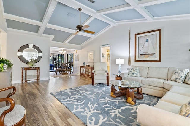 living room featuring hardwood / wood-style flooring, ceiling fan with notable chandelier, and vaulted ceiling