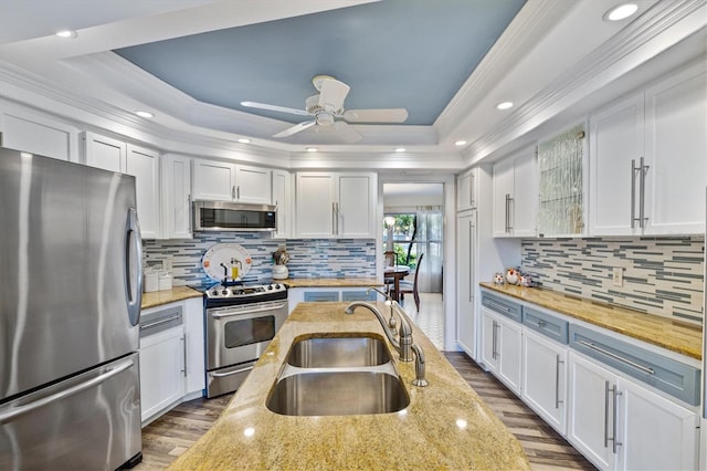 kitchen featuring white cabinets, sink, and stainless steel appliances