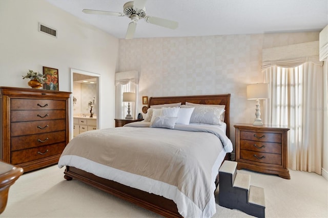 carpeted bedroom featuring ceiling fan, connected bathroom, and vaulted ceiling